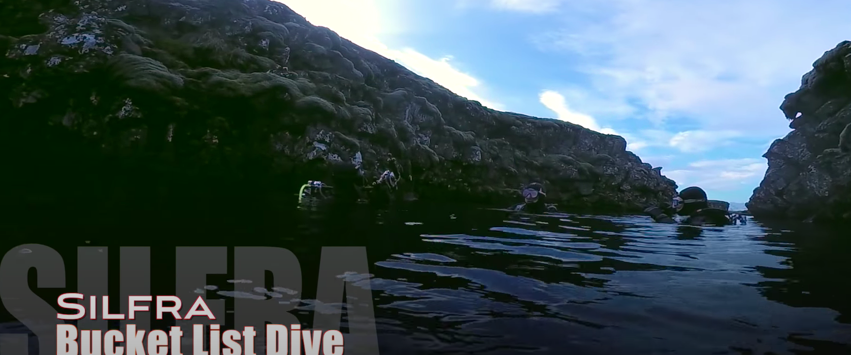 Scuba divers beginning a bucket list dive in Iceland