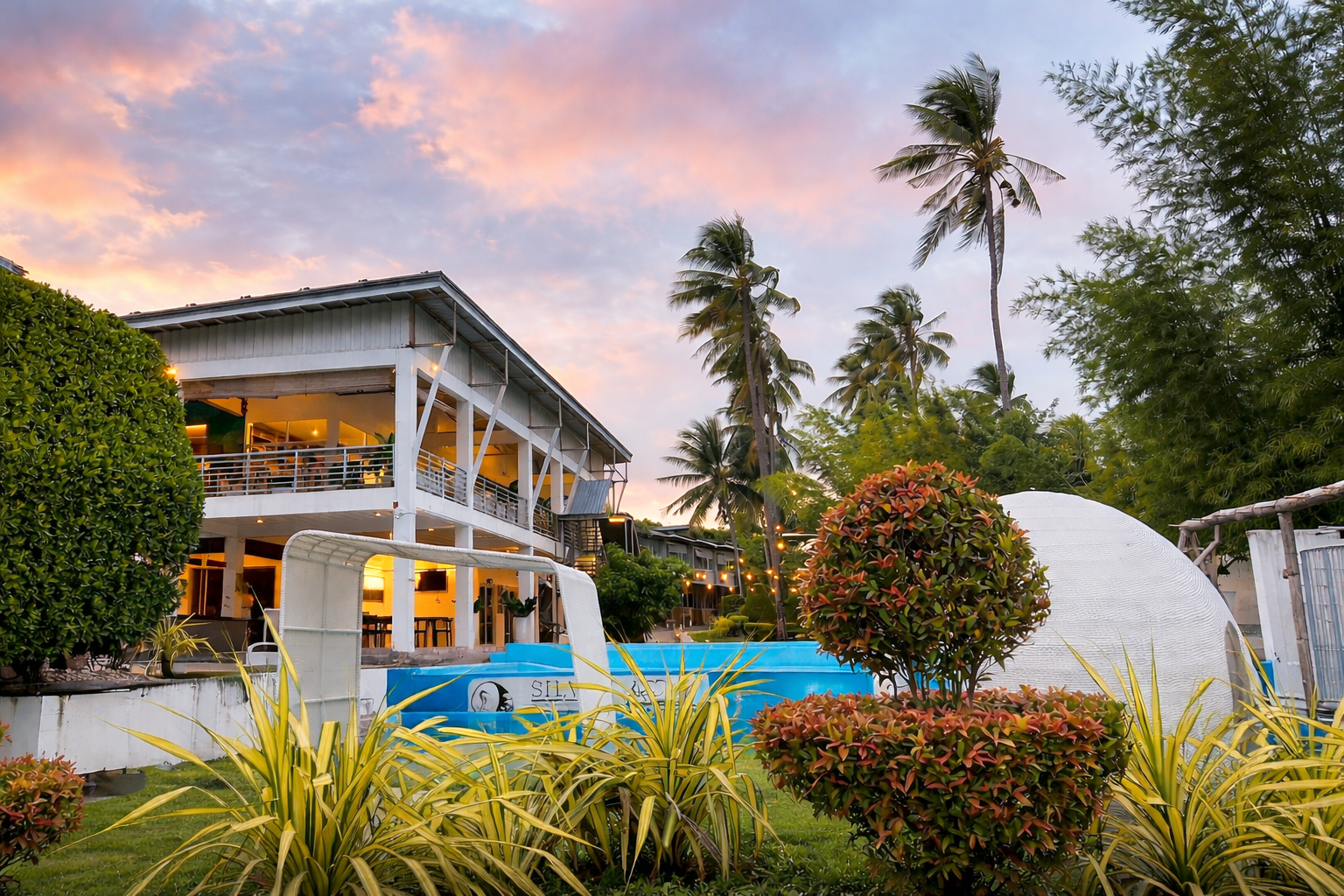Silver Reef Dive Resort in Dauin, Negros Oriental, Philippines at sunset with pool and main building